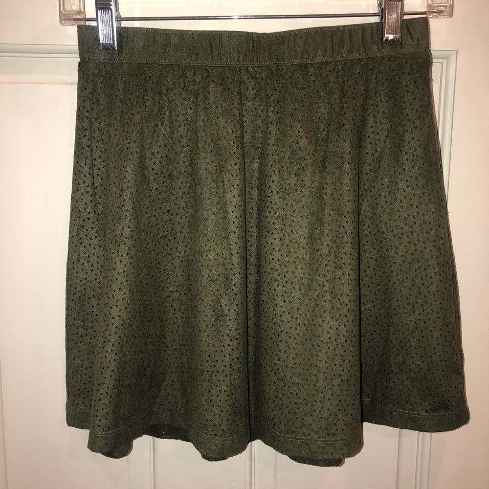 Candie’s olive green skirt.